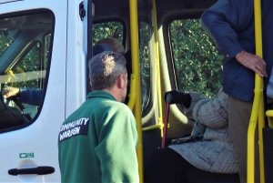 Wye Community Warden seeing Community Lunch diners safely on board the Woodchurch Wagon minibus