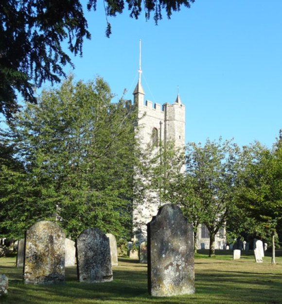 Wye parish church and its peaceful setting, mown by Wye Parish Council as a public green space